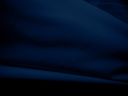 Fabric Texture Blue Cloth Background,Pattern Material Cotton Linen Canvas,Light on Abstract Garment Shape Fashion Textile Black Smooth Color, Dark Navy Satin Backdrop.の写真素材