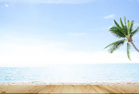 Wood Table on Sea Summer Background,Blue Ocean and Horizon with Desk Space,Mockup Product Tropical,Empty Counter on Shore Island and Sky with Palm Tree,Tourism Travel Tropical Nature Holiday.の写真素材