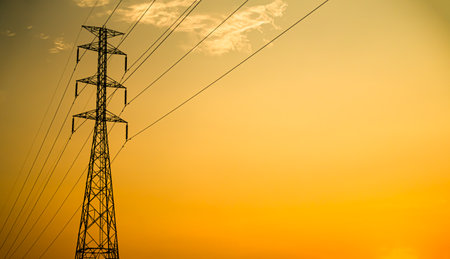 High Voltage Pole on Sunset Background,Line Electric Energy Power Station Tower Hight Voltage Transmission electrician Grid,Danger Technology Construction Plant,Substation Pylon Industry Generator.の写真素材
