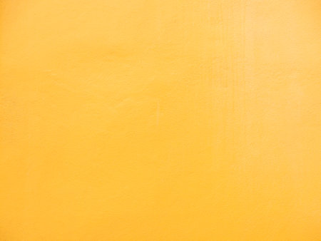 Wall Yellow Background,Texture Orange Paint on Cement Floor Backdrop Vintage Solid Stucco Concrete,Card Tropical Summer,Abstract Surface Rough Material Retro Plaster Paper Pattern Golden Space.の写真素材