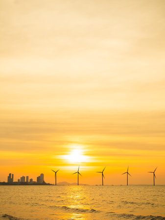 Wind Mill Turbine Farm Offshore on Sunset ,Energy Power Sustainable Plant on Sea Ocean,Electric on Water Nature,Industry Technology Windmill Generation Electricity on Horizon,Environment Ecology.の写真素材