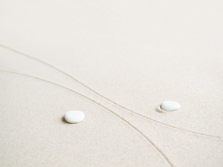 White pebbles on the sand with copy space for text.の写真素材