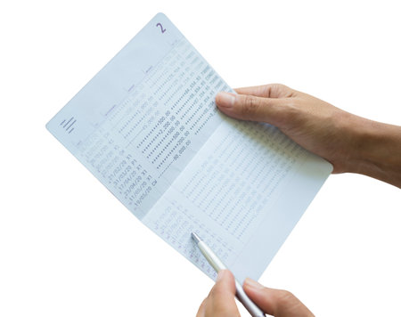 Bank Book Account Passbook Statement Number Money,Hand Woman Check Pay and Income Financial Document Paycheck,Balance Cash Math Investment Page Paper Business,Clipping Path on White Background.の写真素材
