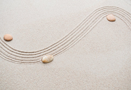 Zen Pattern on Sand Background,Pebble Circle Garden Japanese Line Texture Abstract Mandala Spa on White Beach,Balance Nature Stone Still Mediation Japan Texture Concept,Rock Spirit Harmony Top View.の写真素材