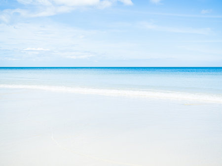 Beach Sand on Sea Summer Background,Wave Water Shore with Blue Sky Horizon Tropical Season,Ocean Seascape at Coast Beautiful,Paradise Island Sun day,for Tourism Relax Vacation Nature Travel in Holidayの写真素材