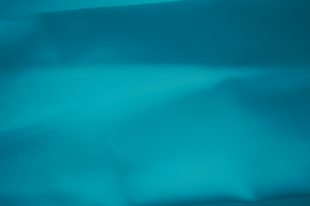 Blue Fabric Background, Cloth Silk Satin Luxury Curtain Material Textile Drape Soft Sheet Polyester Elastic Backdrop, Abstract Texture Close up Sport Soccer Shirt Pattern clothing Wallpaper Fashion.の写真素材