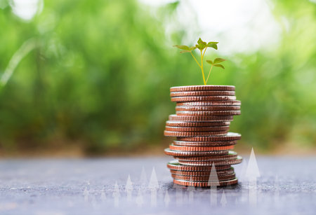 Coin Stack Pile with Growth Tree on blur Green Nature, Tower Cash Money Pay Saving, for Business Finance Success Credit Casino Economy Income Investment Currency Profit, Change Bank Concept.の写真素材