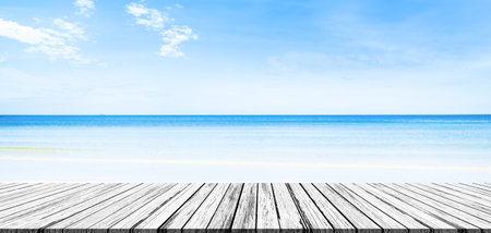 Table on Sea Summer Background, Top Wooden Deck on White Beach Sand Blue Water and Sun Sunny Day, Pier Ocean Tropical Outdoor Landscape Texture Sky Horizon Spring Backdrop for Vacation Tourism Holidayの写真素材
