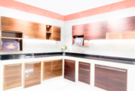Blur Kitchen Interior Background, White Oragne Wood Cooking Blurry View Interior Minimal Counter Simple Empty Stove Floor Wall Top Shelf Room with White Light from Window Home, Minimal  Product.の写真素材