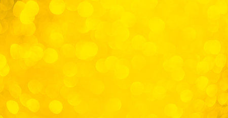 Bokeh Yellow Background Blur Sparkle Pattern Texture Abstract Design Banner Gold Warm Mockup Party Orange Light Autumn Fall Summer Season Spring Sunny Effect Nature Backdrop Minimal Template Scene.の写真素材