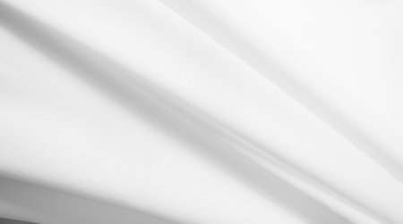 White Cloth Fabric Silk Texture Sheet Wave Luxury Drape Ripple Satin Soft Material Silky Abstract Mesh Pattern Fashion Fold Pure Wrinkle Canvas Template Shadow Drape Gradient Textile Banner Material.の写真素材