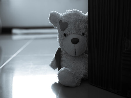 Broken Heart Concept with Alone Teddy Bear Sitting in Room Vintage Card sign Marriage Pain Sad Couple Valentine Day Love Disappointed Symbols Divorce Break Decorative Poster Holiday Space.の写真素材