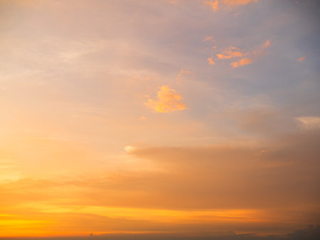 Sunset Sky Orange Sunrise Cloud Evening Beautiful Gold Orange Color Landscape Light Dawn Sunny Cloudy Sun Clear Horizon Clean Calm Day Summer Nature Skyline Morning Tropical Dramatic Backdrop.の写真素材