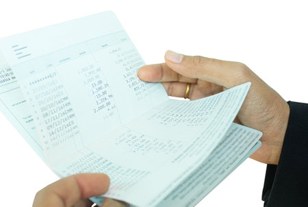 Bank Account Book Statement Balance Number Cash, Hand Holding Data Investment Debt Math in Office, Bill Receipt and Payment Business Credit Card Account, Check Paper Financial Loan Tex Concept.の写真素材