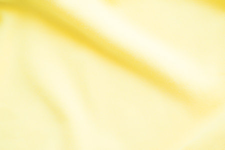 Yellow Background Abstract Cream Color Fabric Textile Fiber Material Polyester Spandex Cloth Sport Pattern Cotton Beige Backdrop Pattern Silk Fashion Satin Summer Card Poster Template Tablecloth.の写真素材