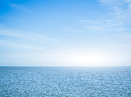 Sea Background Blue Water shore White Sky Horizon Season Summer Tropical Nature, Background Wallpaper Beautiful Seascape Island Outdoor Concept for Tourism Travel Vacation Summer Holiday Relax.の写真素材