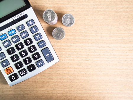 Coin Stack with Calculator free Space, Cash Finance on Table, concept for Loan Cost Money Income Profit  Growth, Taxの写真素材
