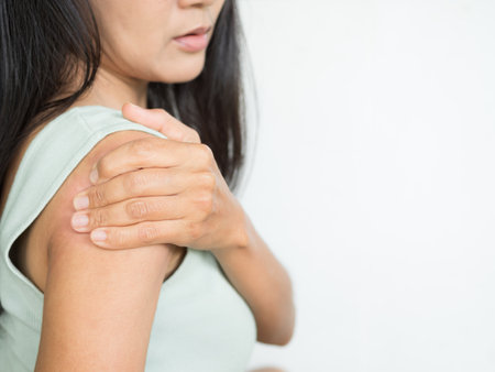 Shoulder pain woman Inflammation Patient Neck Back Backache Injury, Asian Person Back Sore Joint Hand Neck Ache from Exercise Hold.の写真素材