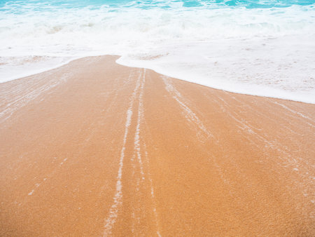 Travel Sea Nature Concept, Shore Sand Water Blue Ocean blur Background, View Calm Texture Wave...