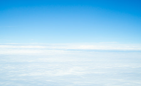 Sky Cloud Background Window Plane Aerial View Air White blue Cloudy High Clear Sunny Landscape Space Beautiful Cumulus Light sun Day Fluffy Scene Landscape Wind Bright Nature Spring Summer Heavenの写真素材