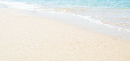 Travel Nature Concept, Sea Sand Background Blue Water at Coast Season Summer Tropical Ocean Beautiful Wave Seascape Vacation Smooth Wallpaper Island Outdoor Tropical Coast Sandy Nature Landscape.の写真素材
