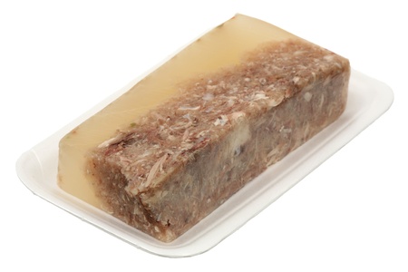 Meat in aspic in the white plastic container の写真素材