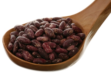 Bowl of uncooked lentils over white background 