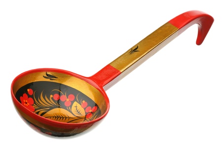 The wooden spoon is isolated on a white background 