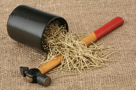 Yellow nails and hammer with the wooden handle の写真素材