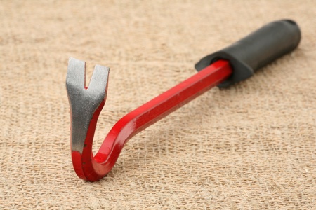 Nail drawer with the rubber handle against a sacking 
