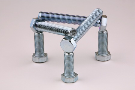 Six bolts on a grey background の写真素材
