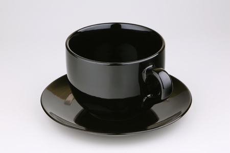 Cup with a saucer on a light background の写真素材
