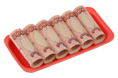 The Russian denominations in the plastic container are isolated on a white background の写真素材