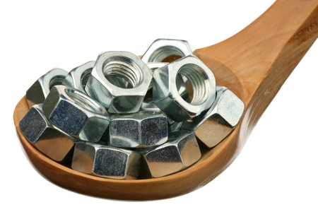 Nuts in a wooden spoon on a white background 