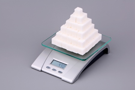 Ninety one slice of lump sugar over gray の写真素材