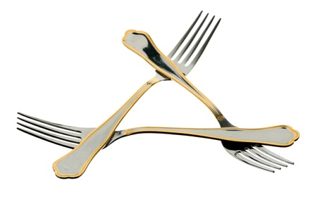 Three metal forks on a white background 