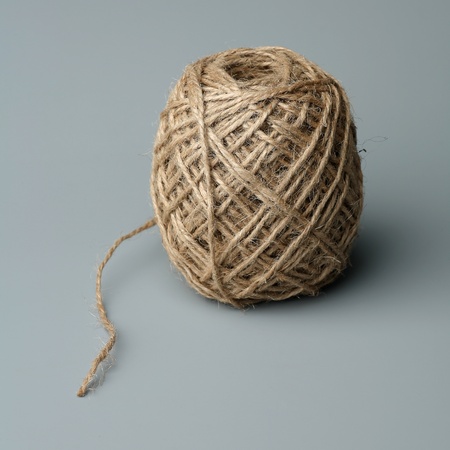 Ball of a twine on a gray background 