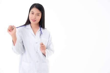 female doctor is standing smiling, with tools to treat patients with confidence, separate from the white background.の写真素材