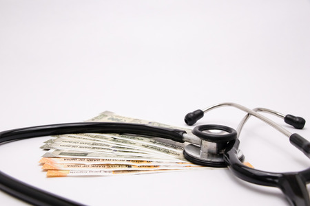 Stethoscope on indian currency  or paper currency white background