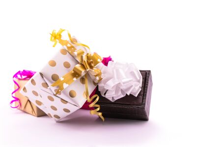 Decorative gift box with ribbons and bows on white backgroundの写真素材