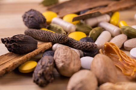 macro shot of scattered whole spices with ayurvedic medicines. Herbal concept
