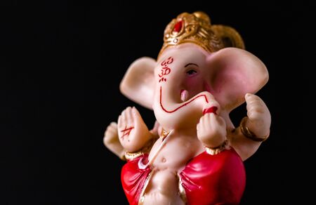 low angle side view close up of beautiful ganesha statue in blessing pose. hinduism conceptの写真素材