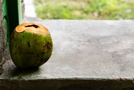 discarded coconut thrown on marble surface against the blurry background with copy space in right. waste management conceptの写真素材