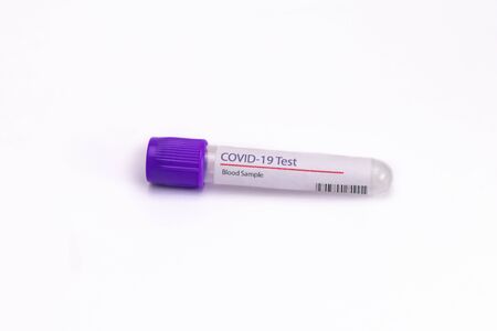 Close up shot of an empty sample collection tube with COVID 19 label on itの写真素材