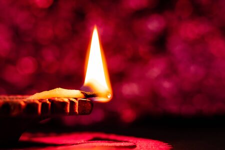 awesome side view of clay diya and rangoli art with bokeh background. festival of lights conceptの写真素材