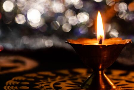 extreme close up of beautiful background and yellow rangoli with blurred background. diwali conceot