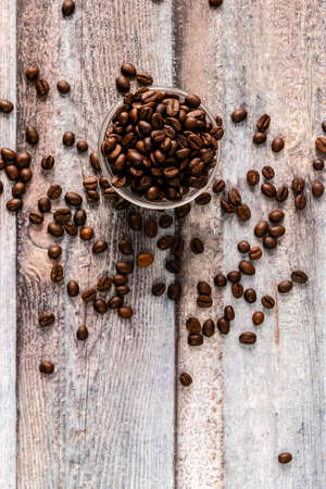 Top shot of coffee beans in glass bowl with portrait orientation and copy spaceの写真素材