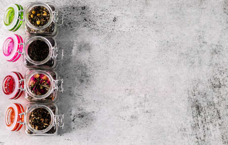 Over the top shot of jars filled with dry tea and copy spaceの写真素材