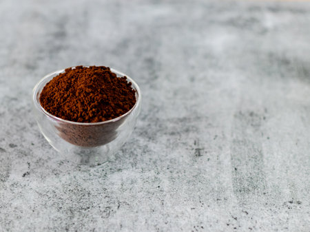 High angle of coffee powder in glass bowl with Copy space on Defocused background.の写真素材