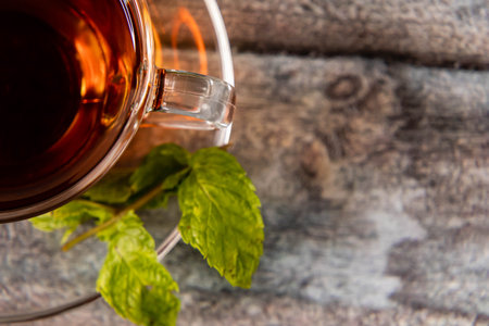 Top close up shot of black with defocused mint leaves and copy space.の写真素材